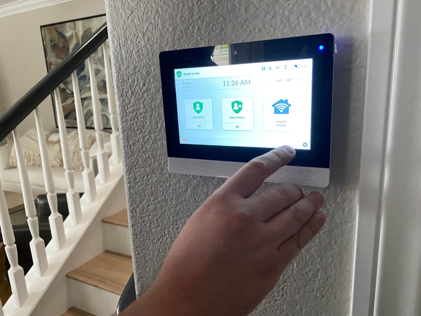 Security system control panel being activated for property protection.